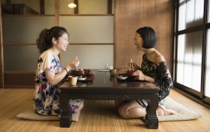 Japanese women at table in traditional restaurant