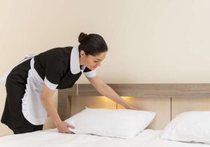 chambermaid-cleaning-hotel-room-872x610